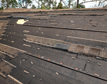 San Diego roof inspection in progress with missing shingles